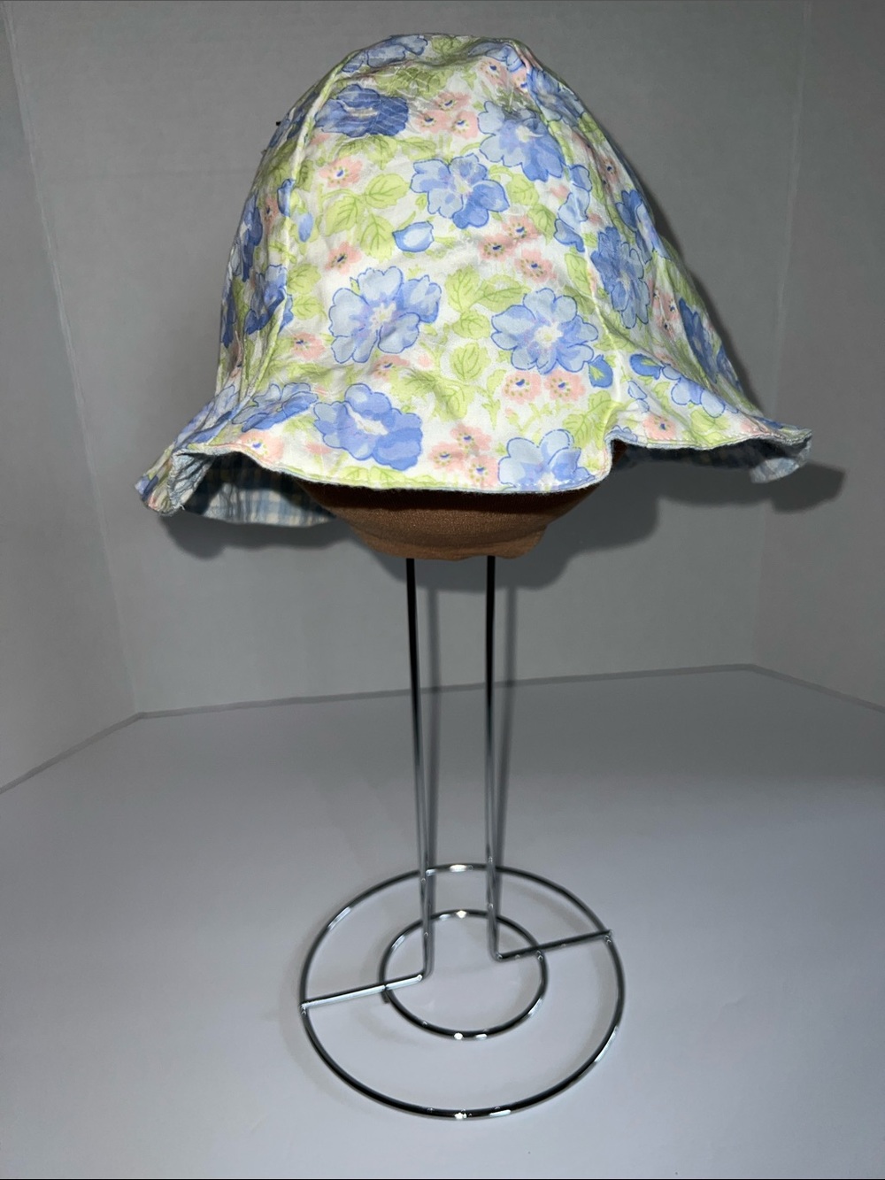 Reversible Baby Lulu Bucket Hat With Floral and Blue Gingham print.